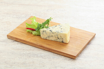 Blue cheese piece over board