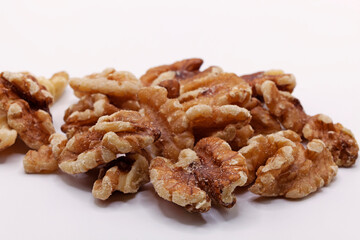 a pile of walnuts on a white background