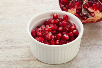 Ripe red Pomegranate seeds in the bowl