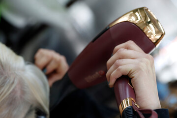 Using a dryer in a hair salon