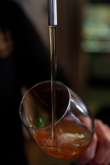 Pouring beer in a glass