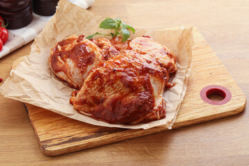 Marinated chicken leg in tomato sauce