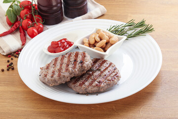 Grilled beef burger cutlet with sauce