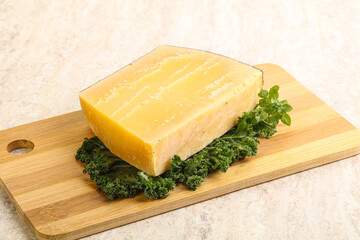 Parmesan cheese piece over board