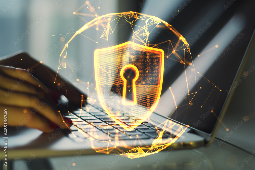 Poster Close up of hands using laptop keyboard with abstract glowing polygonal sphere with glowing digital padlock shield on blurry background. Safety, protect and technology concept. Double exposure.
