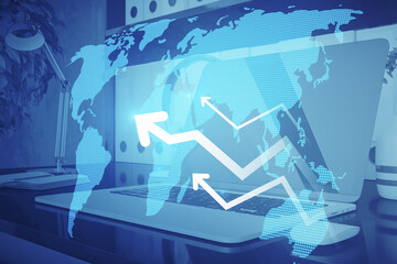 Close up of workplace with laptop, digital map and arrows on blurry blue background. Global business and growth concept. Double exposure.