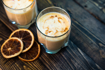 Yellow Indian mango yoghurt drink Mango Lassi or smoothie with turmeric and saffron.