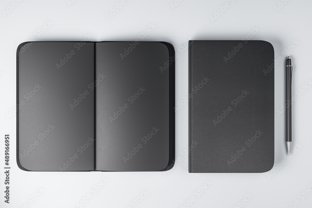 Poster Top view on all-black notebooks with black empty pages and plain pen on white surface background. 3D rendering, mock up