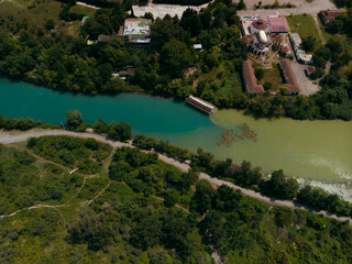 A place where two rivers of different colors meet. Aerial view panorama. Mountains. Travel and vacation concept. Summer day. Mtskheta in Georgia.