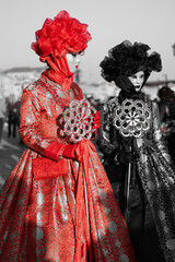 person in red dress in Venice Carnival