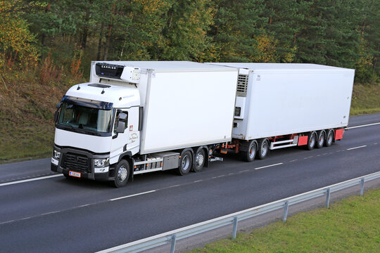 White Renault T Truck and Refrigerated Trailer at Speed on Motorway.
