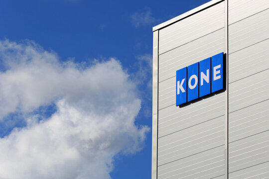 KONE Logo at KONE People Flow Center Building in Hyvink&auml;&auml;, Finland, and blue sky with clouds.
