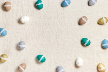 Frame from pastel colored dyed Easter eggs, decorated  white tape lace, card or background for Happy Easter celebration, Dyed chicken egg on home table, minimal lifestyle  aesthetic photo