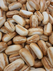 French small or mini baguettes in a bakery or grocery store. Freshly baked bread