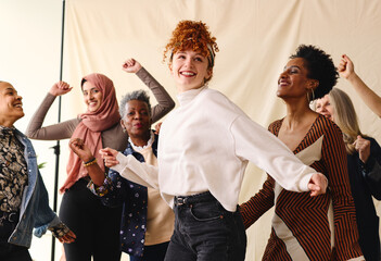International Women's Day candid portrait of multi ethnic mixed age range women dancing