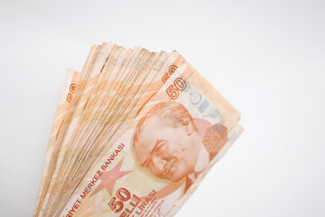 A large wad of Turkish lira money on white background