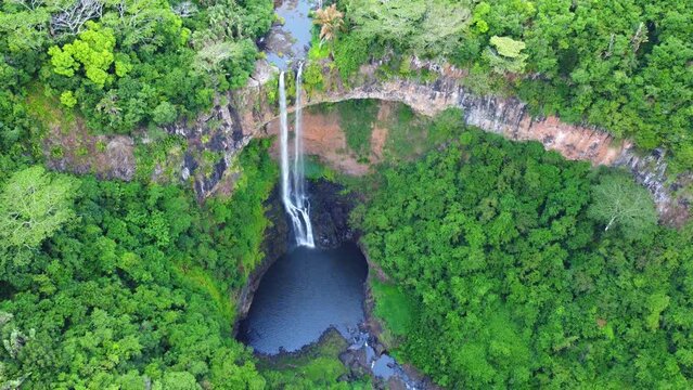 Chamarel Falls on the island of Mauritius, drone video of the waterfall surrounded by jungle