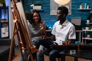 Designer artists working at authentic art project creating masterpiece drawing vase illustration on canvas using graphic pencil. Students sketching draw in painting atelier. Concept of creativity