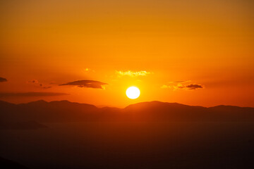 Sun setting on a mountain horizon at the Basque Country.