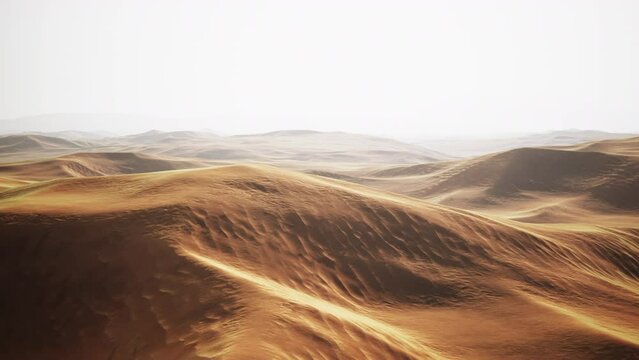 sunset over the sand dunes in the desert