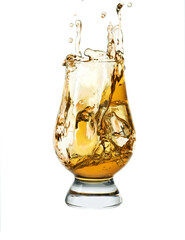 Glass of splashing whiskey with ice isolated on white