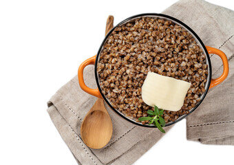 Boiled buckwheat porridge in a bowl. Natural organic buckwheat porridge.White background.Buckwheat contains a large amount of vitamins and minerals.