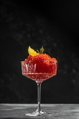 Delicious red caviar in bowl, Close-up salmon caviar. Delicatessen. Gourmet food. Seafood. appetizer, vertical image. top view. place for text