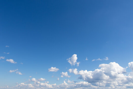White clouds in a blue sky with free space