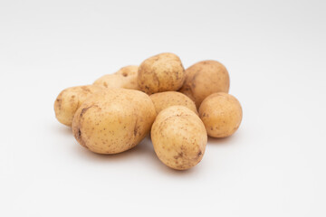 Fresh young potato on white background