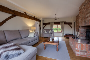 Bright cosy living room with beams
