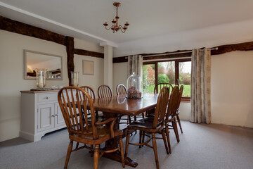 Bright dining room with wooden table and chairs
