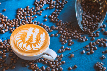 coffee latte art on wood table, relax time, cafe barista art top view.