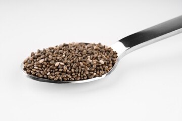 Chia seeds isolated with white background. Pile of healthy chia seeds background.