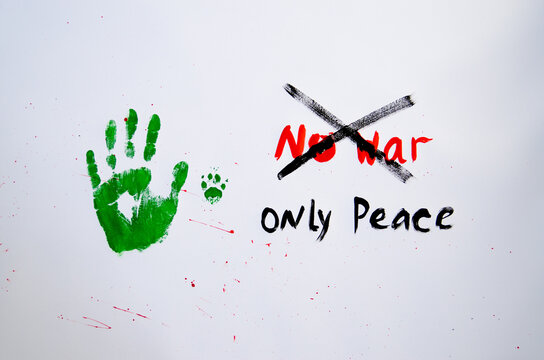 No war text with handprint and dog's paw print on white background,soft focus. Green handprint of human and dog's paw print with red drops - Powered by Adobe