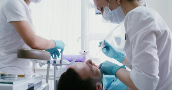 Dental examination of the patient's teeth using a camera