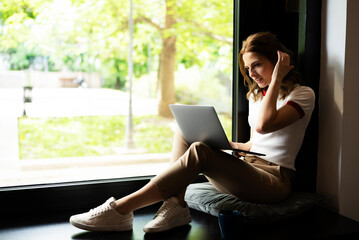 Young businesswoman using laptop in the office. Beautiful woman learning online
