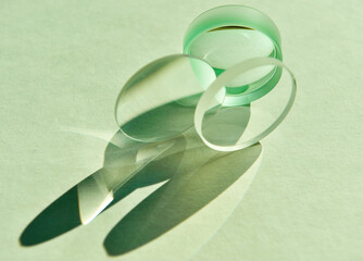 Close up of sunlight through clear circular convex and concave lens with different focus lengths...