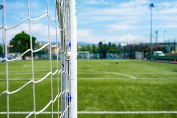Soccer or football net background, view from beside the goal