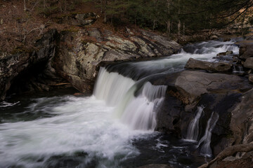 Naklejka premium Flowing Waterfall in Mountain River