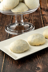Delicious izmir bomb or izmir bombasi on a white plate on wooden table