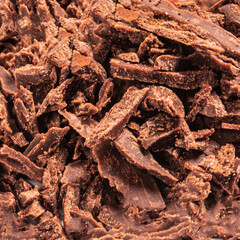 Grated Chocolate as a textured background. Crushed dark chocolate Pattern. Wallpaper. Top view.