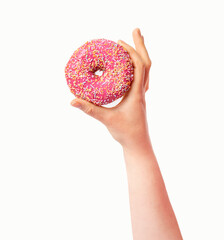 Female hand holding pink donut over white background. Top view, flat lay. Sweet, dessert, diet...