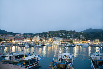 Fishing boats draggers, motorboats, and yachts, moored in the Marina di Camerota&rsquo;s port, Italy.