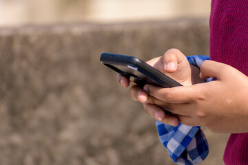 Teenager girl hand holding smartphone
