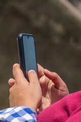 Teenager girl hand holding smartphone