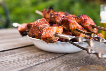 Top view of tasty shish kebab from pork on plate
