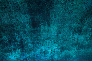 Abstract dark blue background with scuffs and scratches.