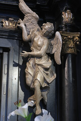 Fototapeta na wymiar Angel statue in the chapel of Our Lady of the Kamenita vrata (Stone Gate) in Zagreb, Croatia