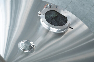 Mash vats of a brewery. Large metal fermentation tanks