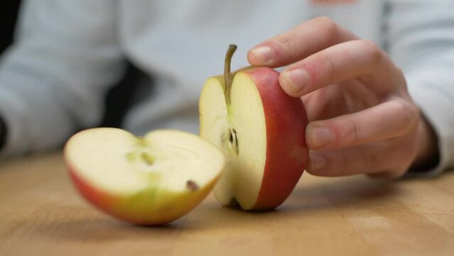 Cutting an apple in half